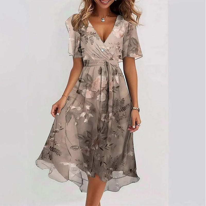 Woman wearing a floral dress on a plain background