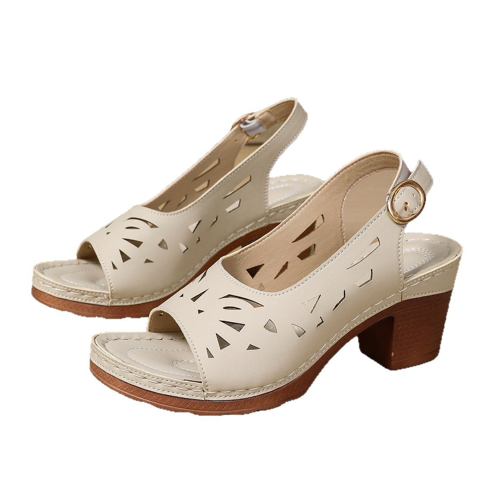 Pair of beige sandals with wooden sole on a white background