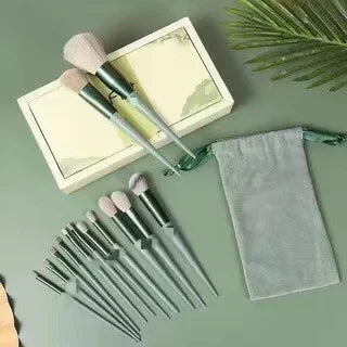 Green makeup brush set with soft bristles, storage pouch, and gift box on green background