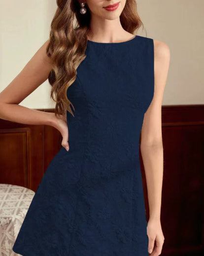 Navy blue dress worn by a model indoors
