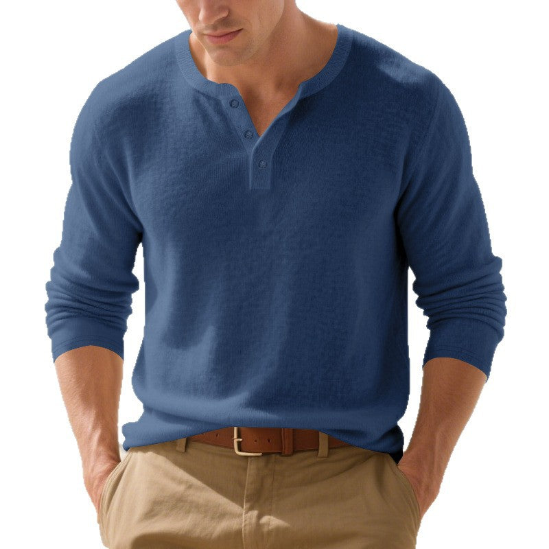 Man wearing a blue long-sleeve henley shirt on a white background