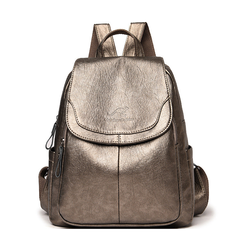 Metallic silver backpack on a white background