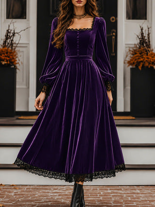 Woman wearing a purple velvet dress with black lace trim in front of a house.