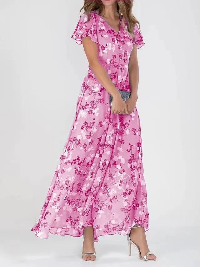 Woman wearing a pink floral dress on a white background