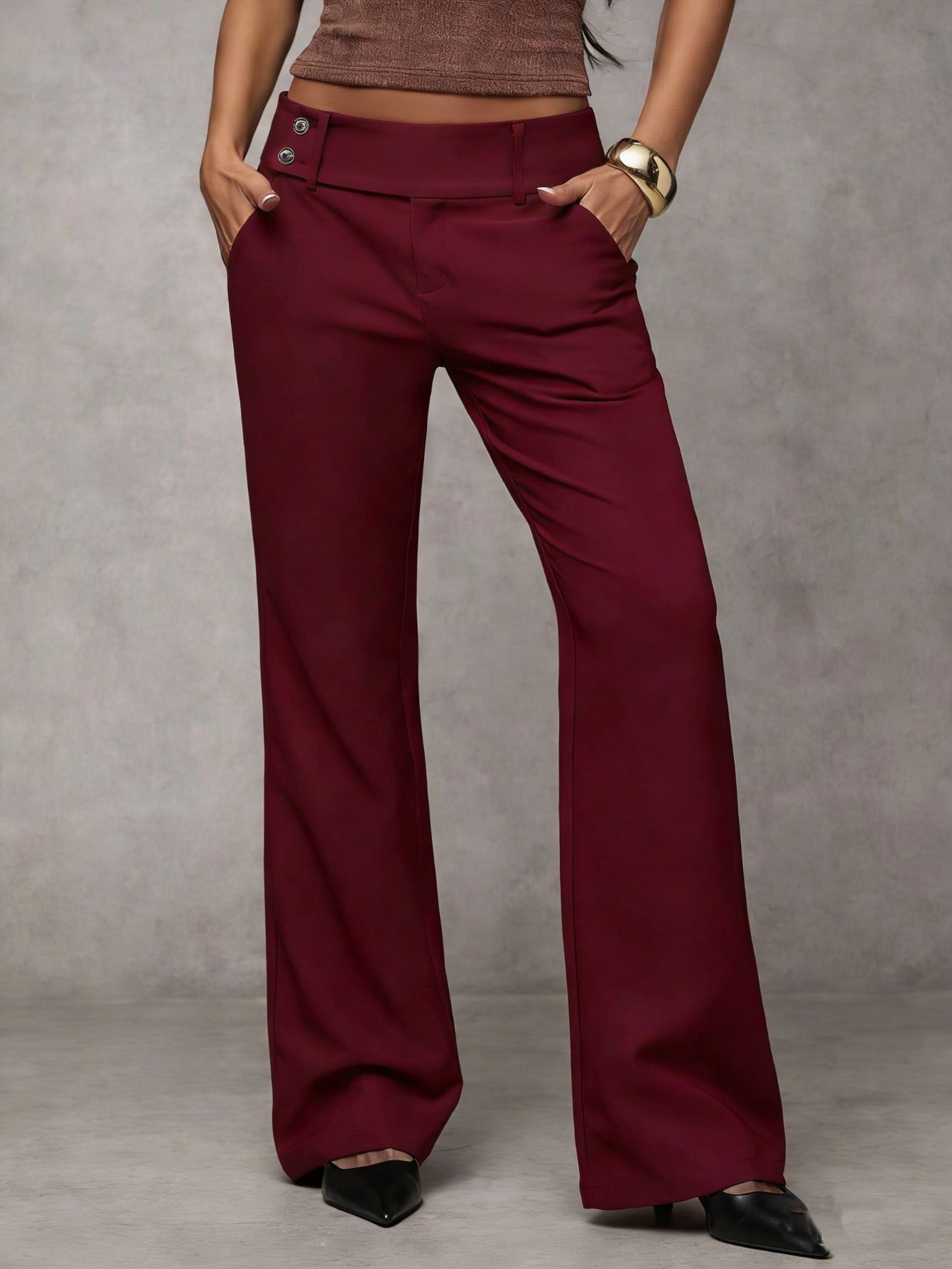 Maroon wide-leg pants worn by a person on a neutral background