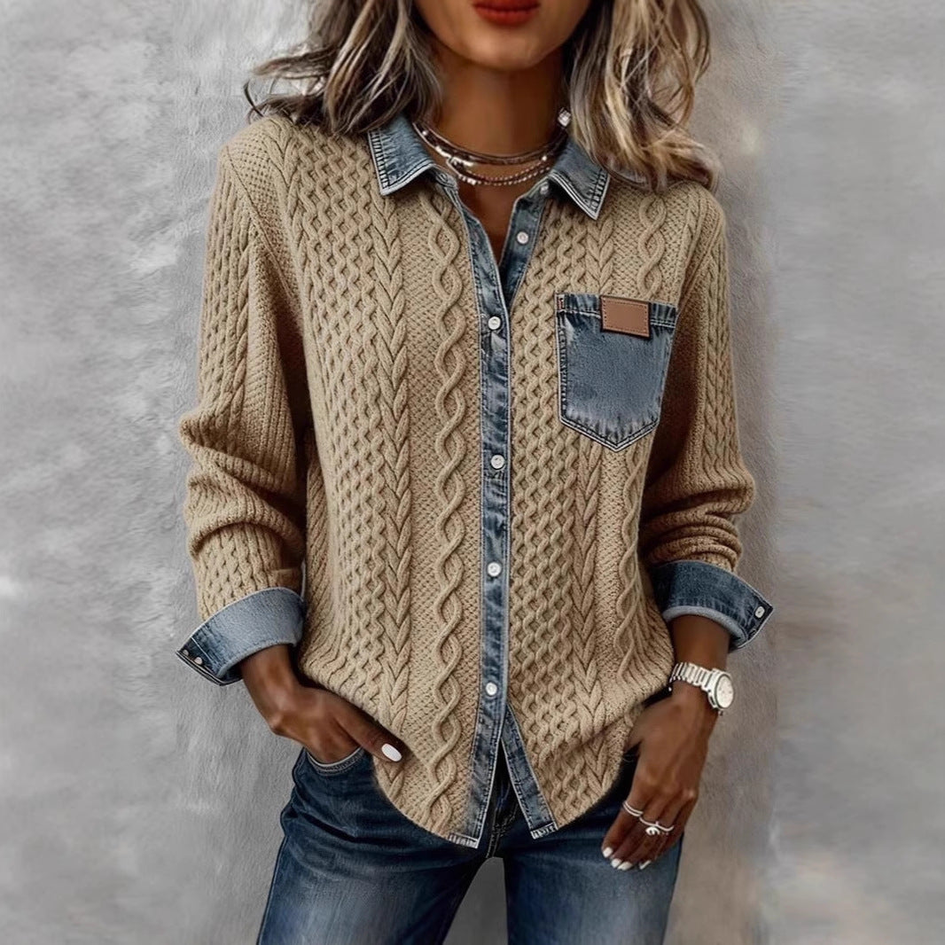 Person wearing a beige cable knit sweater over a denim shirt with a gray background