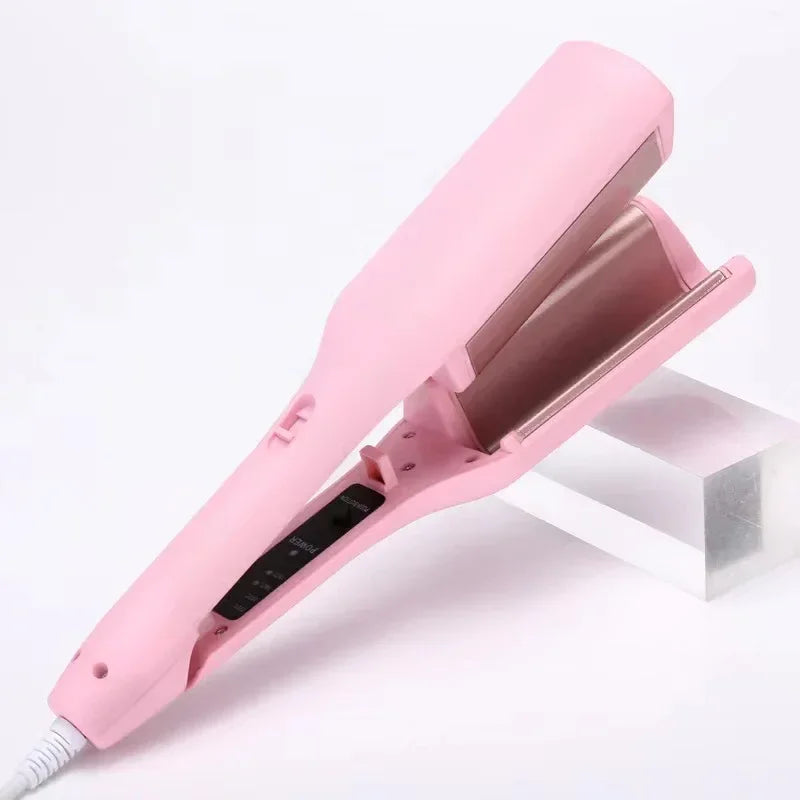 Pink ceramic hair straightener with wide plates for styling, shown on white background