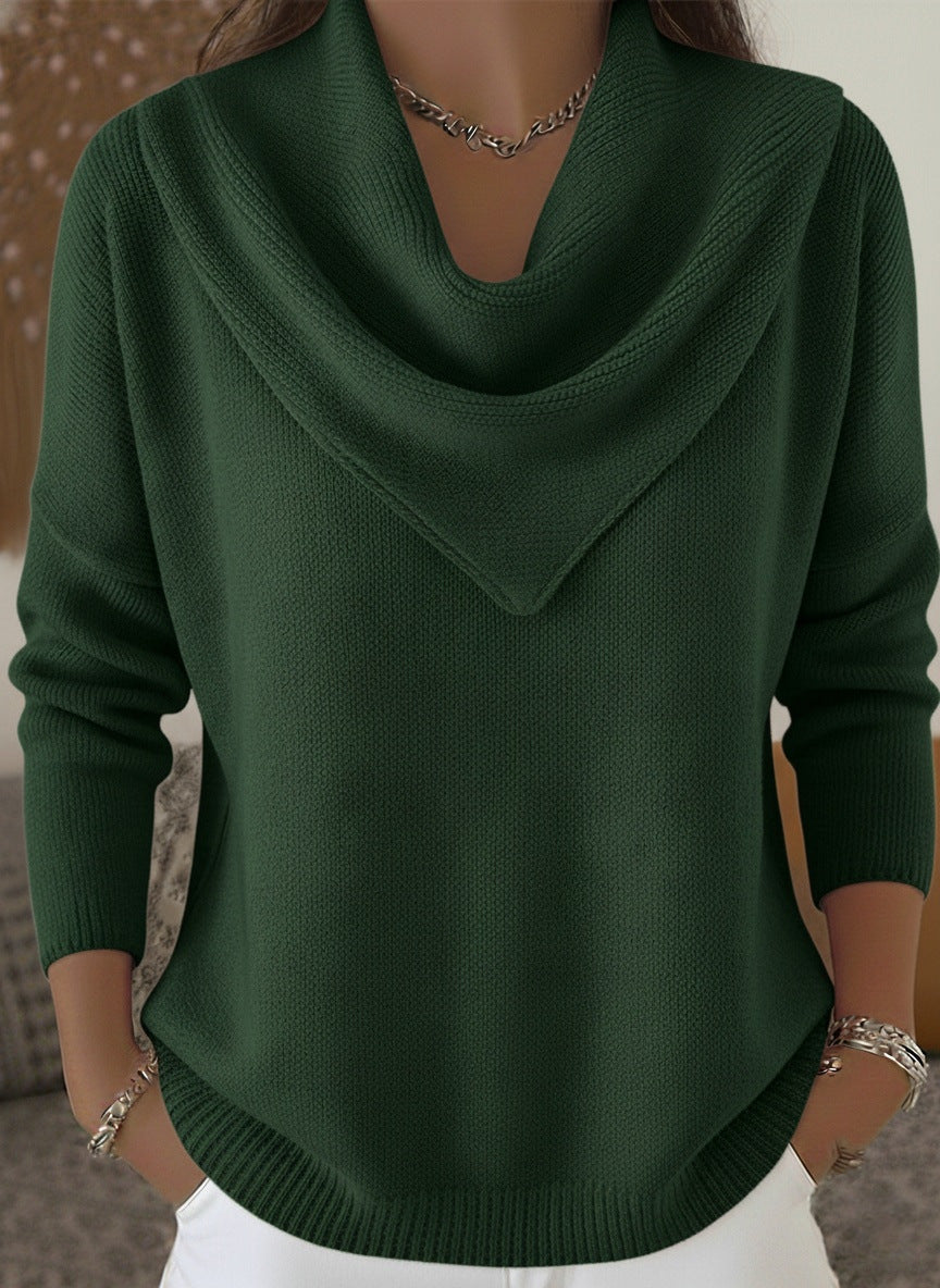 Green sweater worn by a mannequin against a neutral background