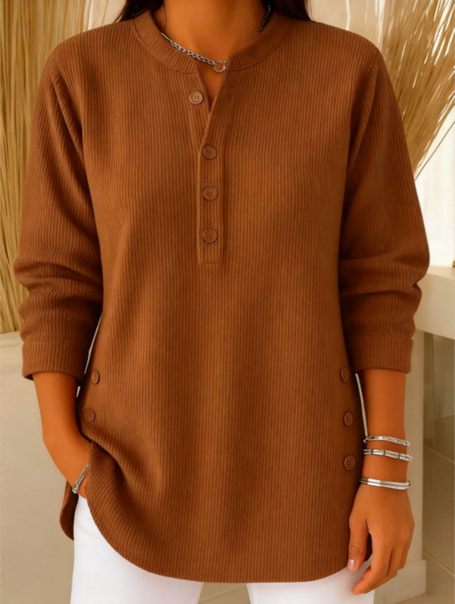 Brown ribbed sweater worn by a person with a neutral background