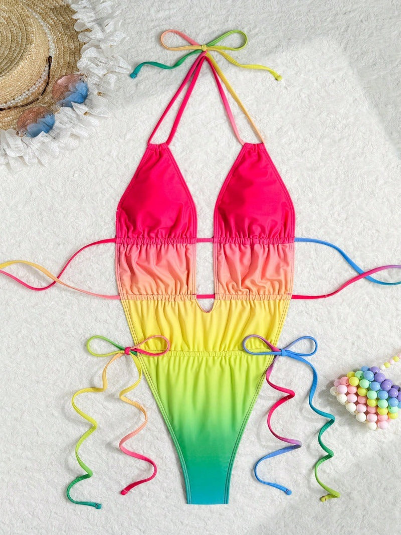 Colorful gradient bikini with pink top and green bottom on a white background