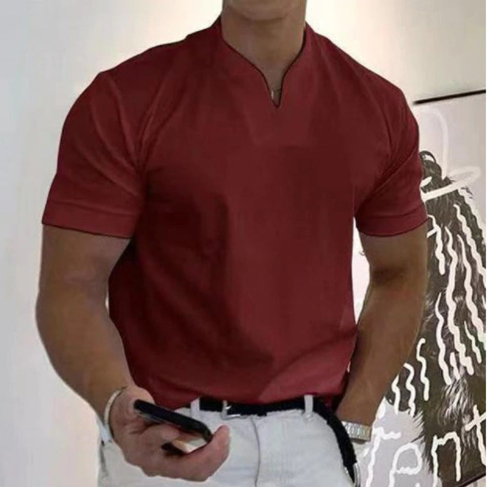 Person wearing a red polo shirt with a white background