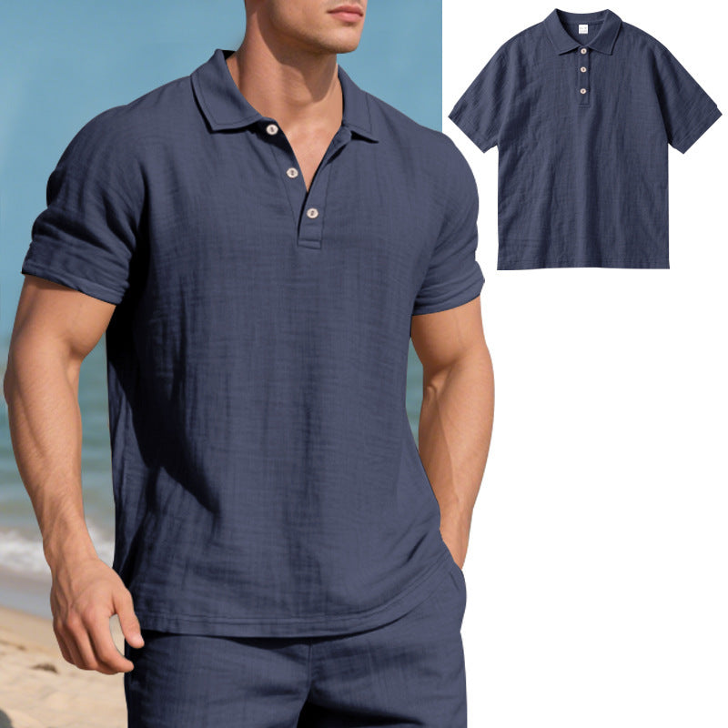 Man wearing a navy blue polo shirt on a beach with a close-up inset of the shirt.