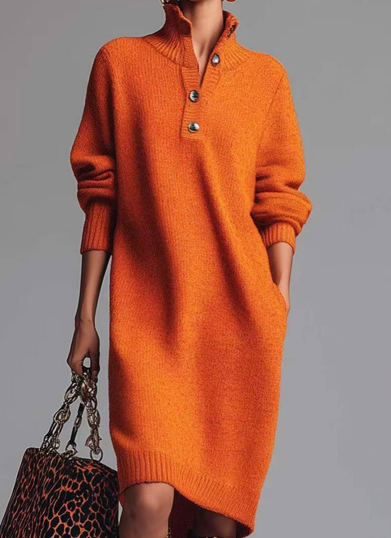 Orange sweater dress worn by a person on a gray background