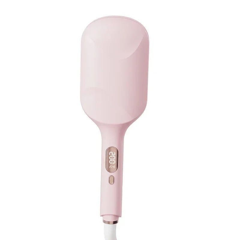 Pink hair straightening brush with digital temperature display, modern beauty accessory