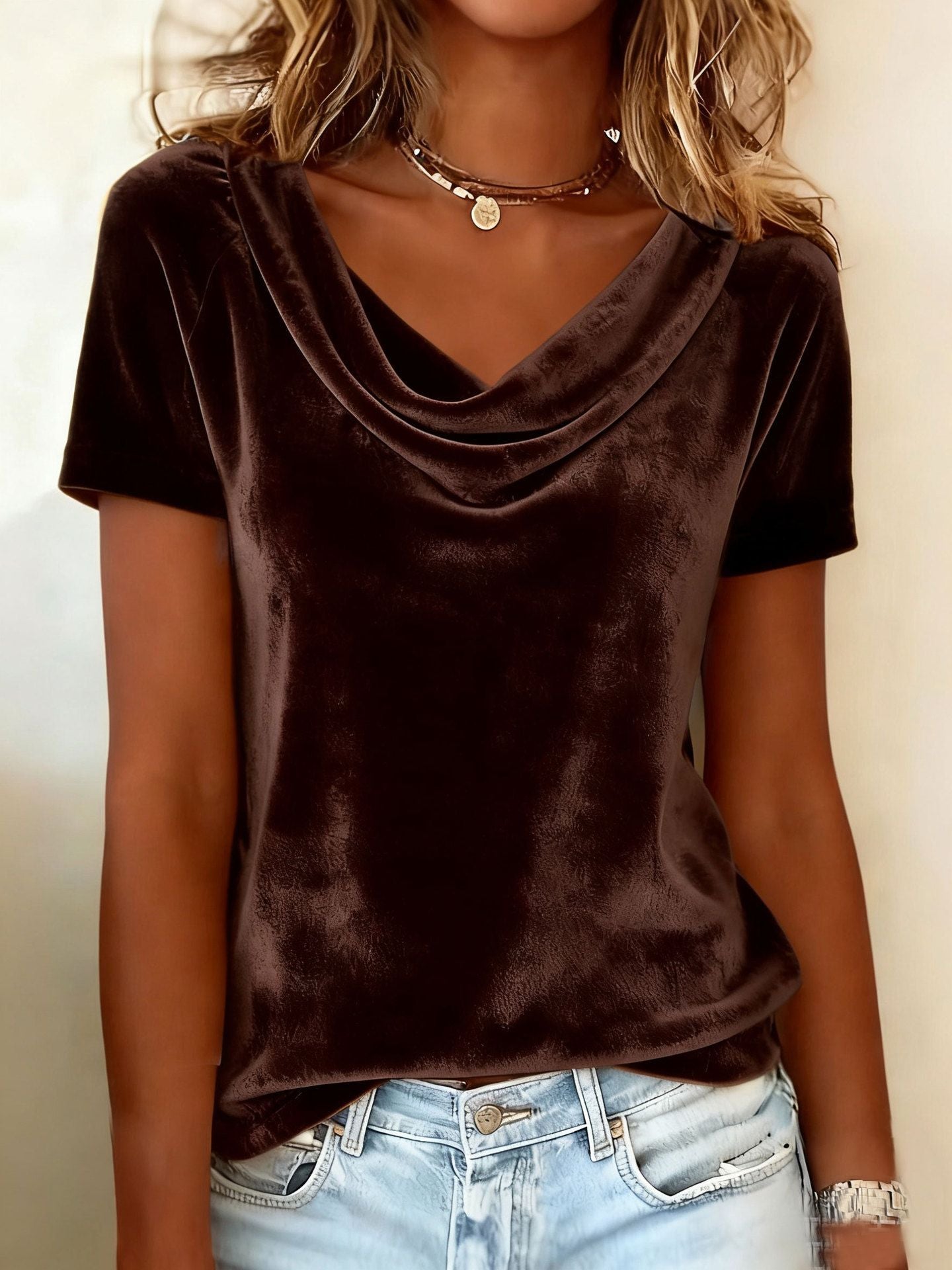 Brown velvet top worn by a person with a neutral background