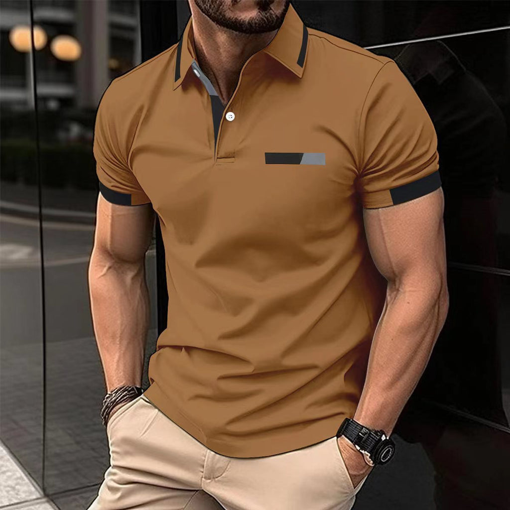 Man wearing a brown polo shirt with black accents in an urban setting