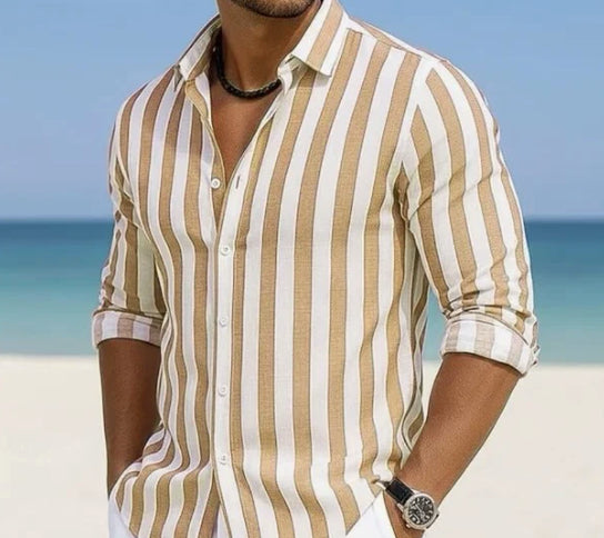Man wearing a striped shirt on a beach