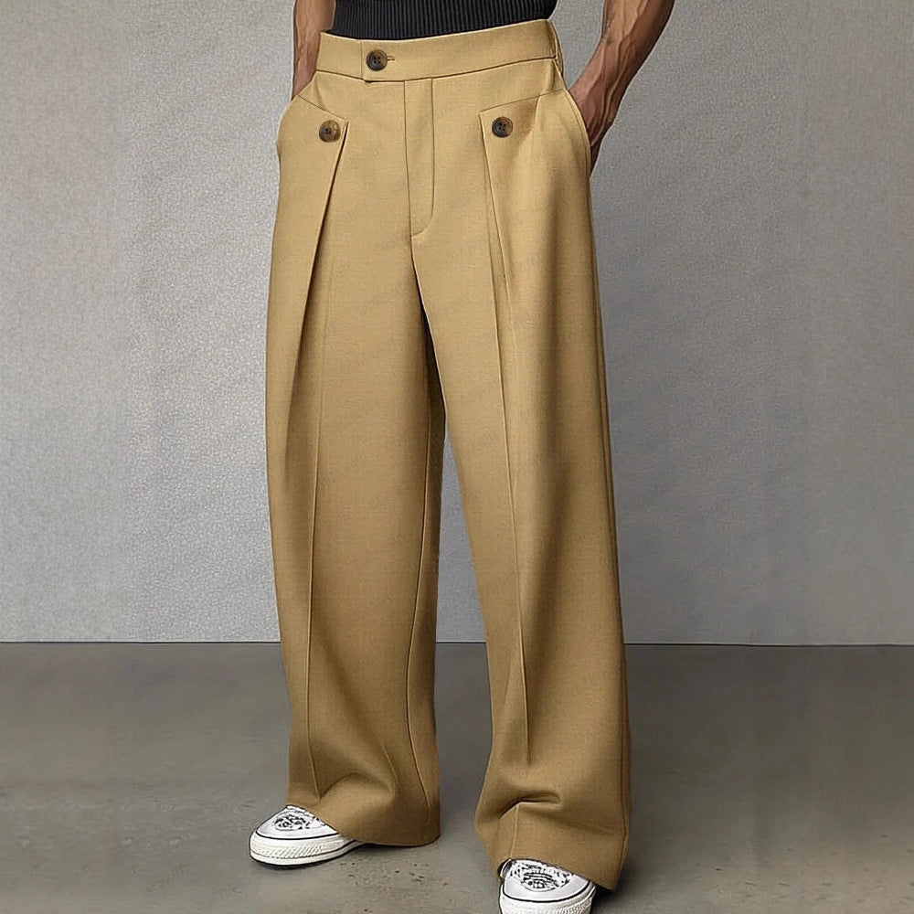 Beige wide-leg pants worn by a person on a gray background