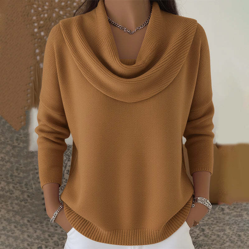 Brown cowl-neck sweater worn by a person with a blurred background