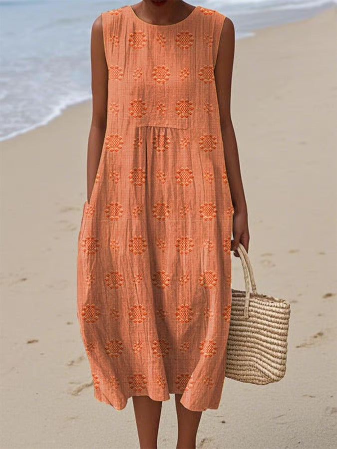 Person wearing an orange dress with a beach background