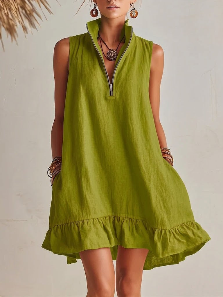 Woman wearing a green dress with a neutral background