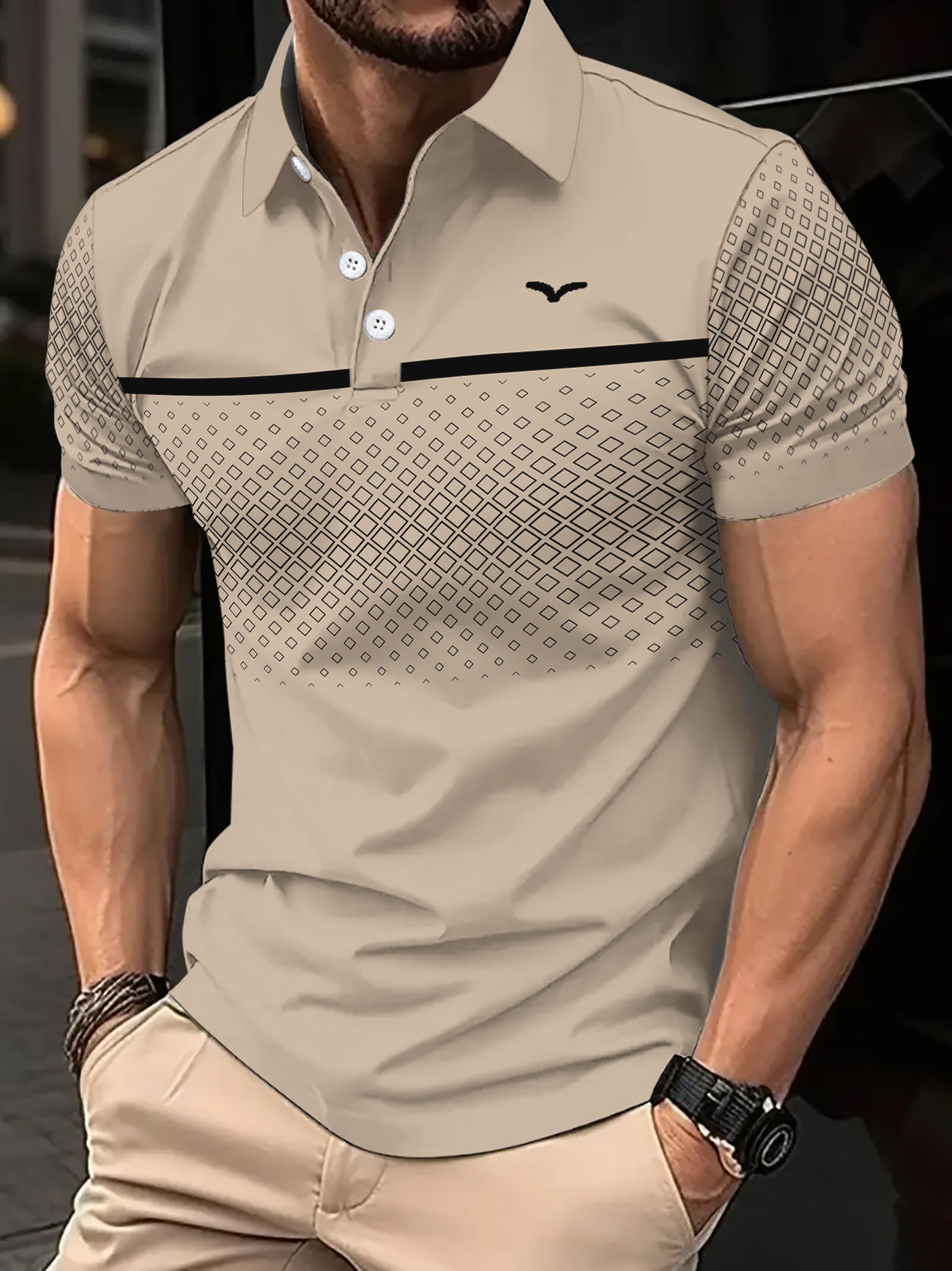 Man wearing a beige patterned polo shirt with a blurred background