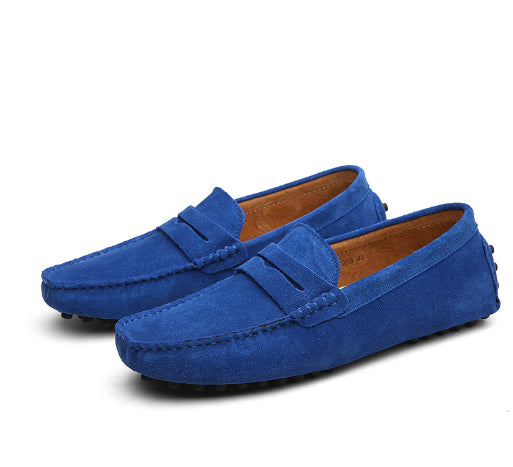 Pair of blue loafers on a white background