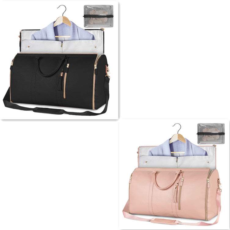 Black and pink duffel bags with clothes on hangers and packing cubes on a white background
