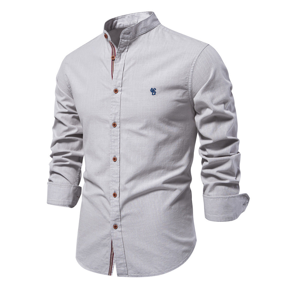 Light gray shirt with button details on a white background