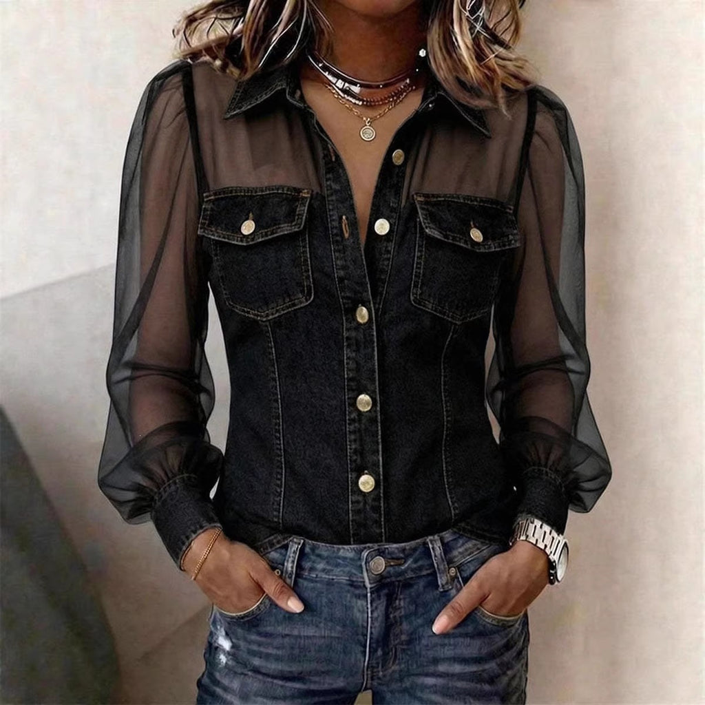 Person wearing a black denim shirt with sheer sleeves against a neutral background