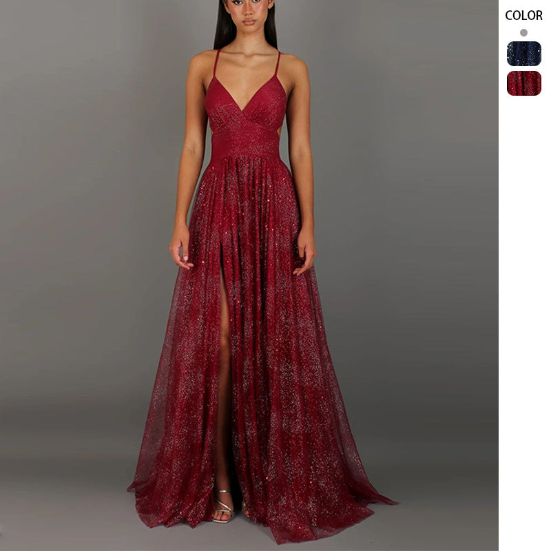 Red evening gown with a slit on a gray background