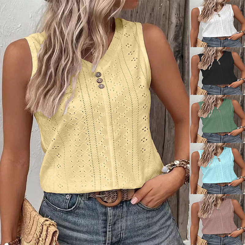 Woman wearing a yellow sleeveless top with button details, standing against a wooden wall.