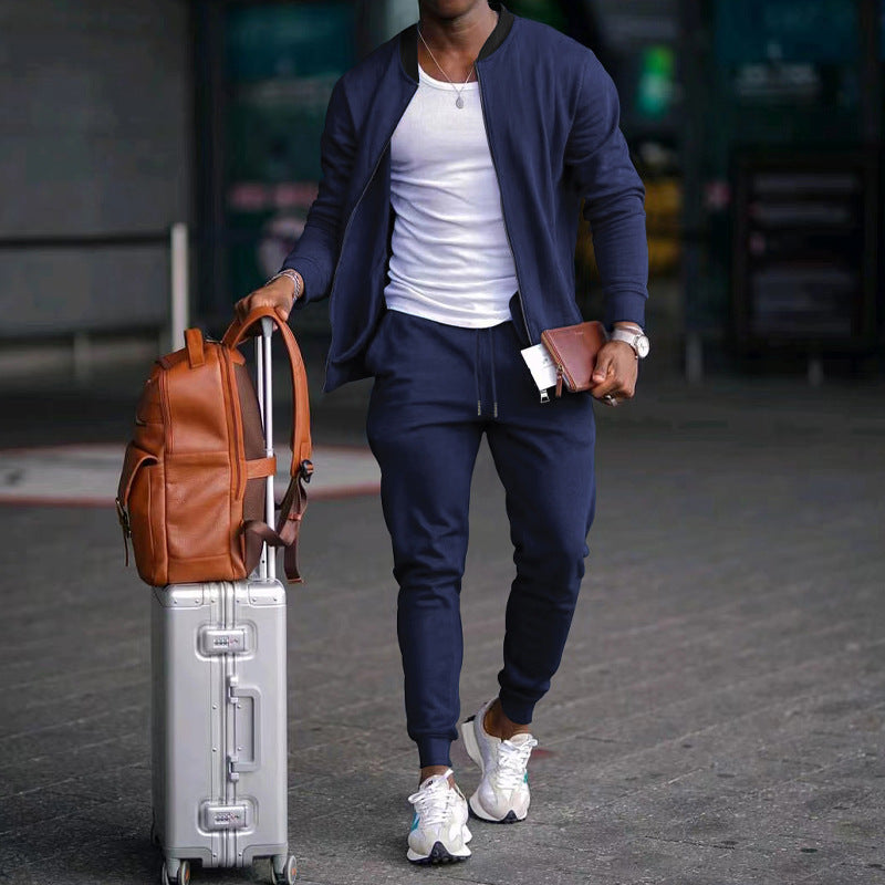 Man with luggage and a backpack walking outdoors