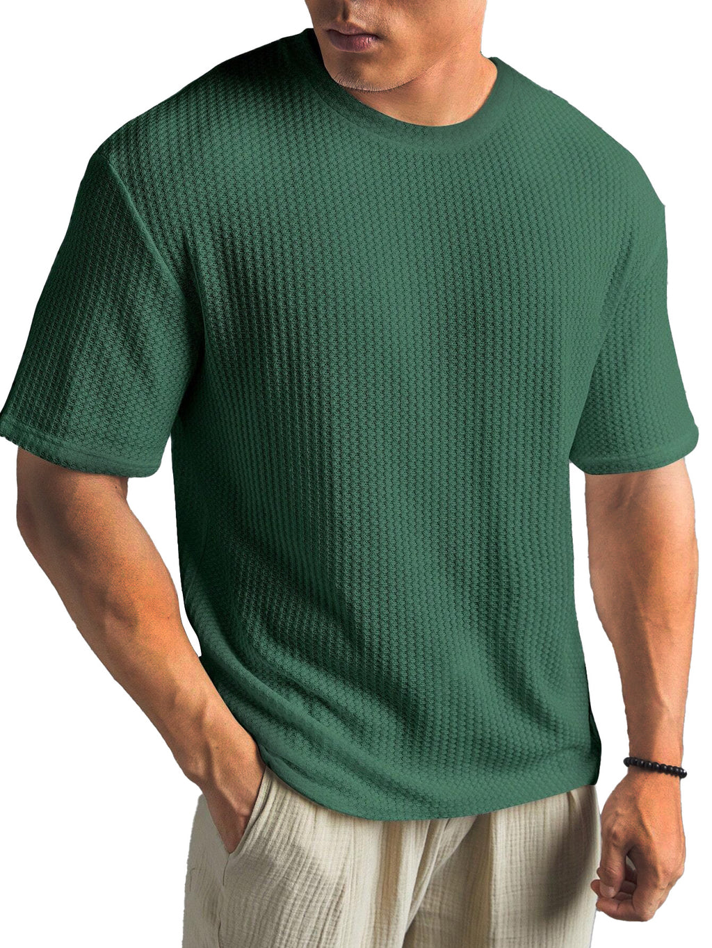 Man wearing a green textured t-shirt on a white background