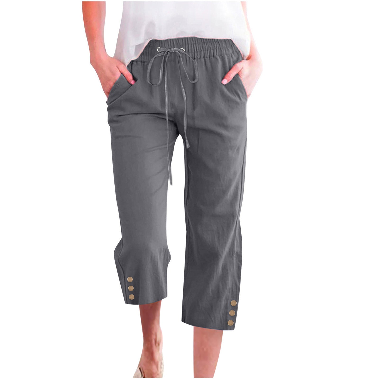 Gray capri pants worn by a person on a white background