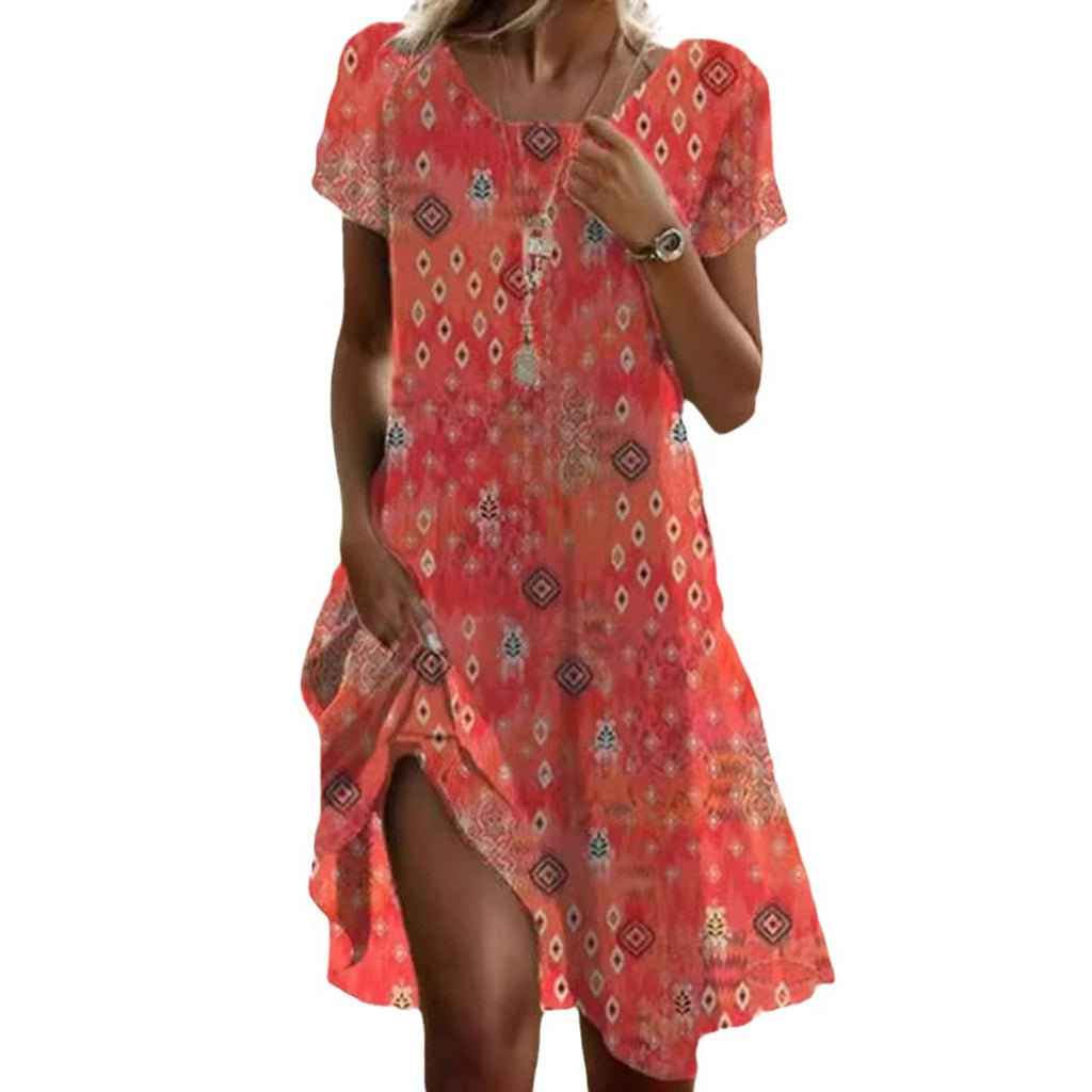 Woman wearing a red patterned dress on a white background