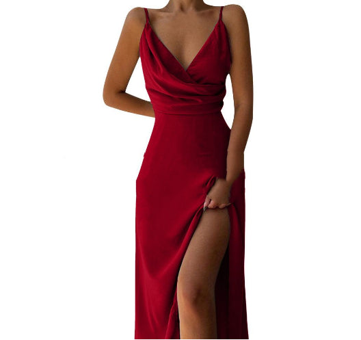Red evening gown with a deep neckline and slit on a white background