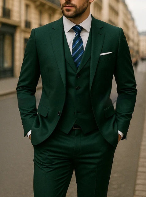 Man wearing a green suit with a blue tie on a city street.