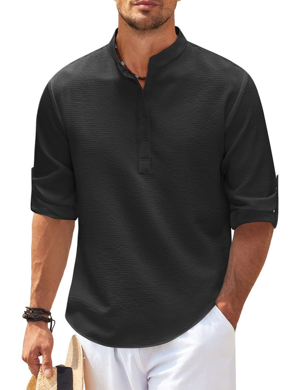 Man wearing a black short-sleeve shirt with a white background