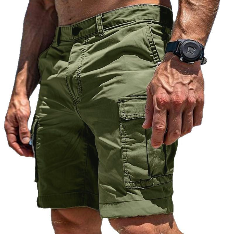 Person wearing green cargo shorts with a white background