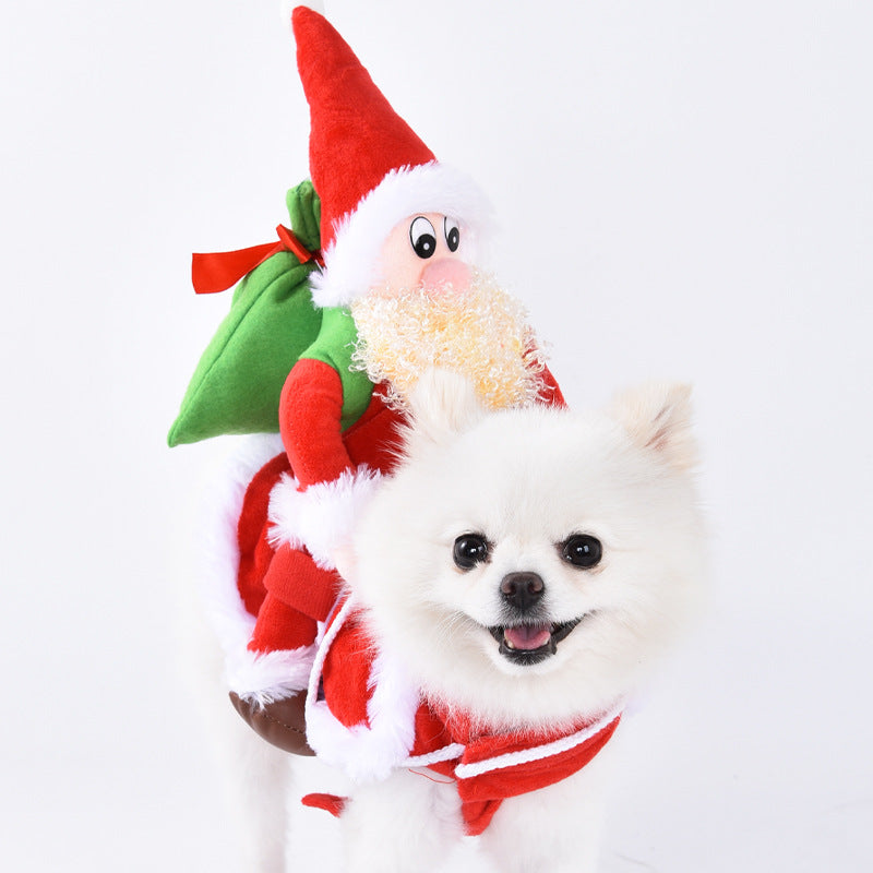 White dog wearing a Santa Claus costume with a small plush toy on top against a white background