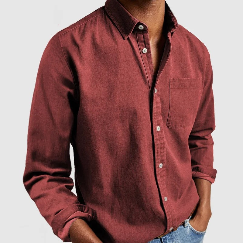 Maroon button-up shirt worn by a person on a light gray background