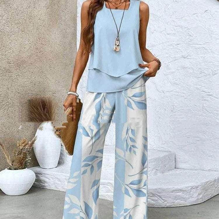 Woman in light blue sleeveless top and floral wide-leg pants, ZA-Zola trendy fashion