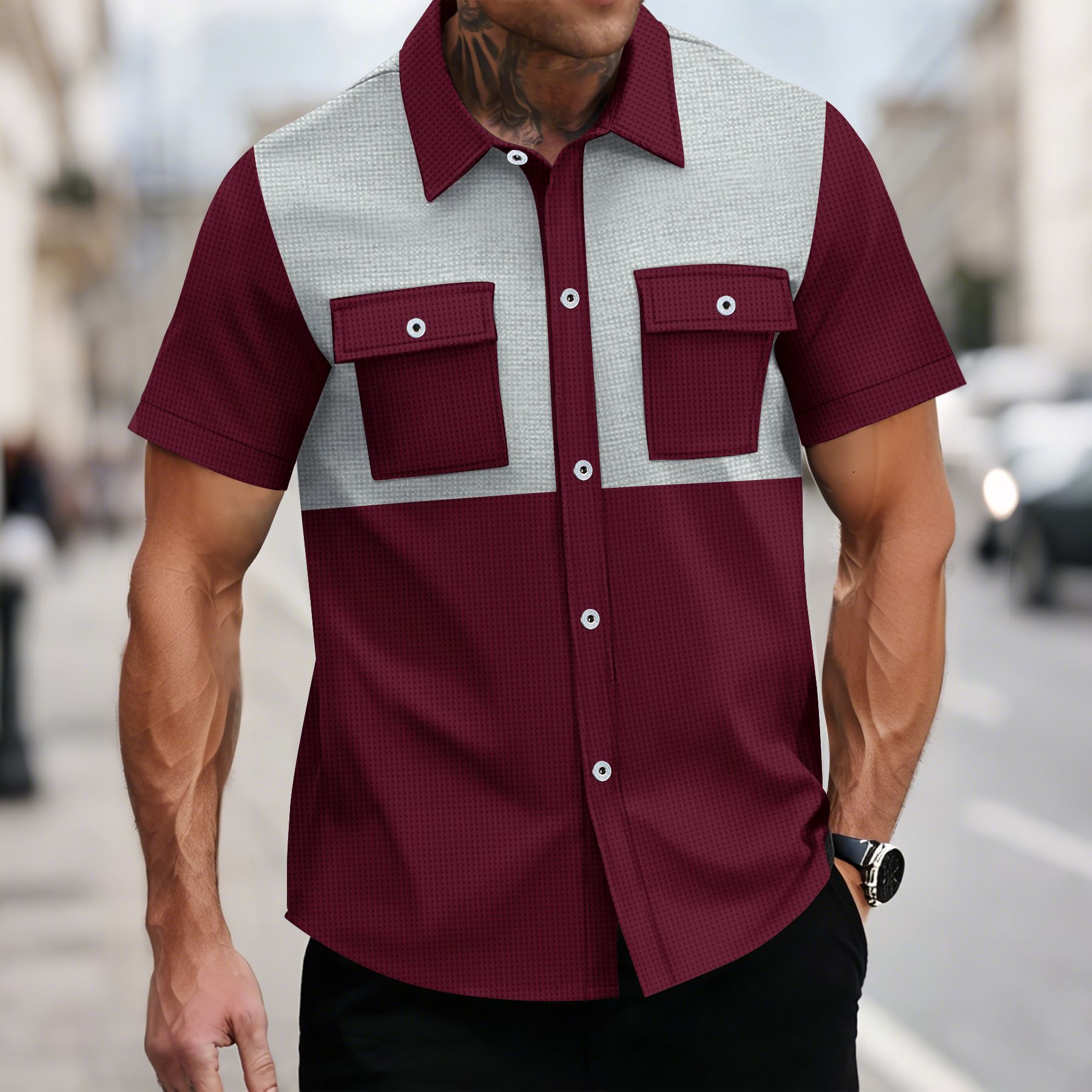 Man wearing a maroon and gray checkered shirt with a blurred street background