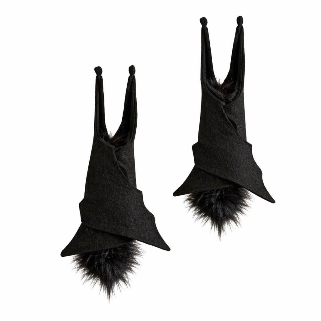 A pair of black witch-style pointed hats with fluffy faux-fur trim, displayed against a solid white background.