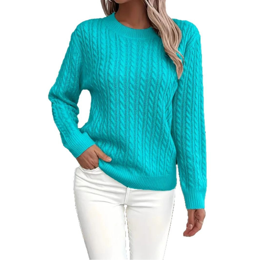 Teal cable knit sweater worn by a person on a white background