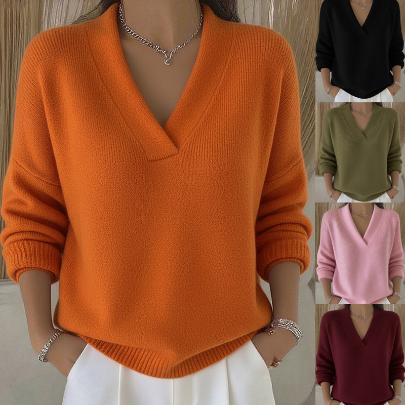 Orange sweater worn by a person with additional color options displayed.