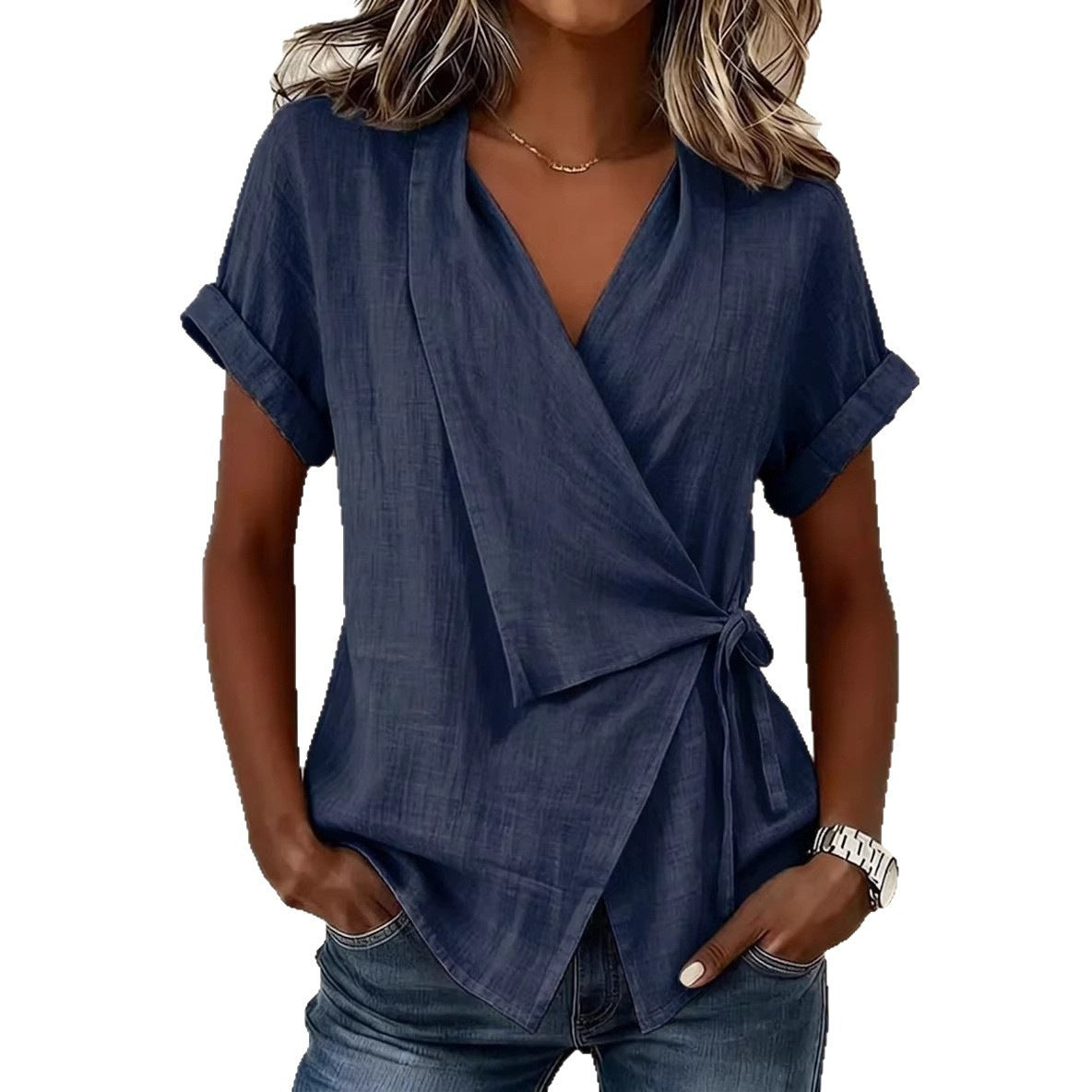 Woman wearing a navy blue wrap top on a white background