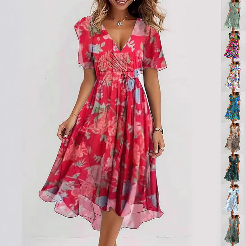 Woman wearing a red floral dress on a white background