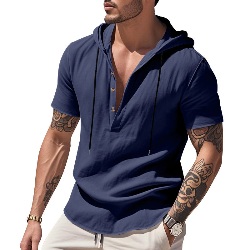 Man wearing a blue short-sleeve shirt with a hood on a white background